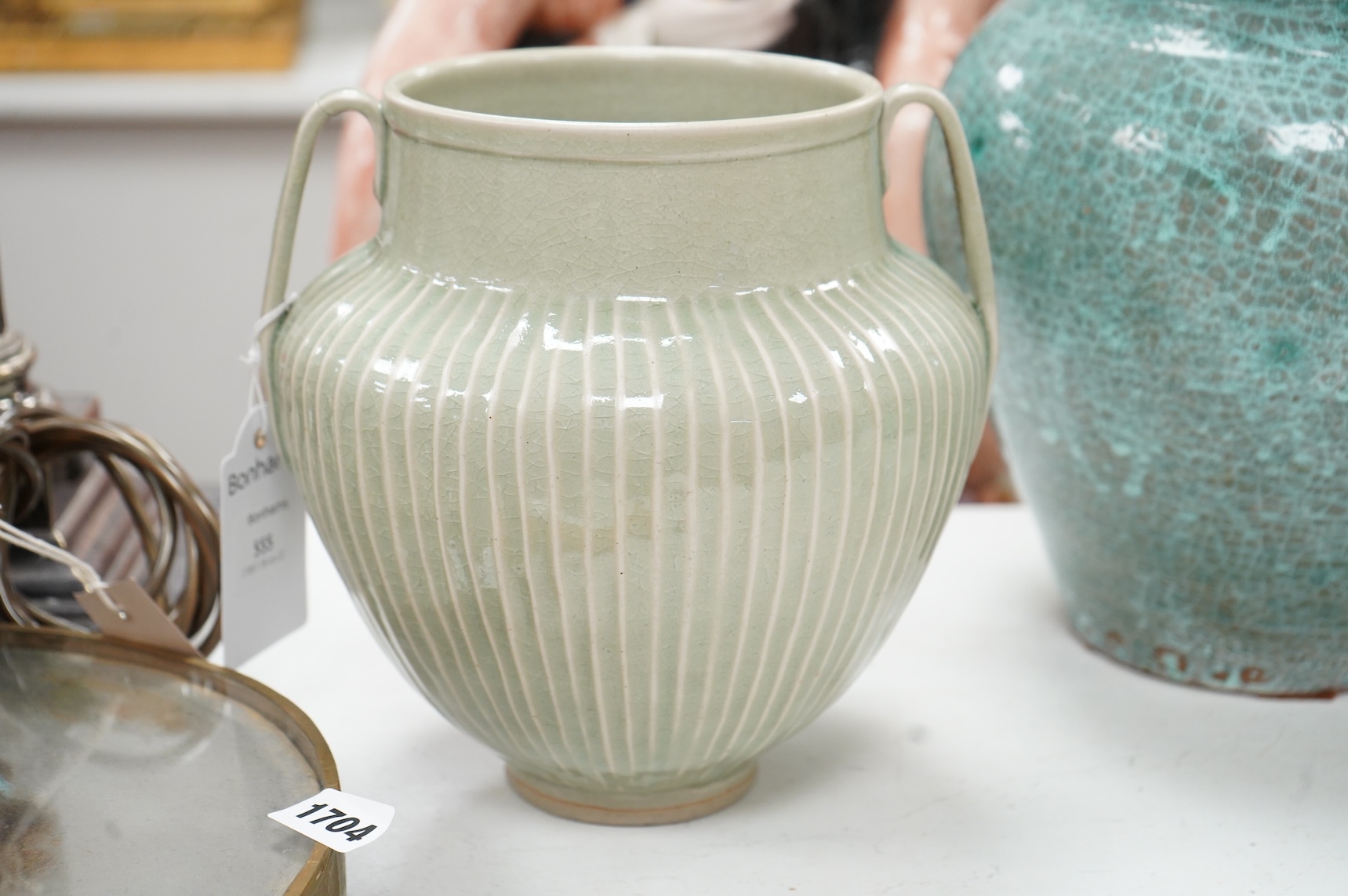 A group of Continental green glazed earthenware vessels including a crystal glazed jug, largest 29cm high